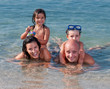 Photo: Happy family having fun in the sea Happy family having fun in the sea