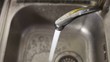 Running faucet in kitchen