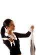 Young woman picking up her dry cleaning.