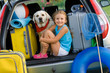 Girl with dog ready for travel for summer vacation