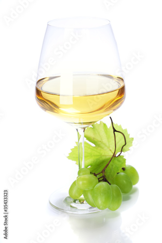 Photo: wineglass with white wine and grape wineglass with white wine and grape
