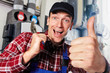 Foto: plumber with multigrip pliers and thumb up plumber with multigrip pliers and thumb up