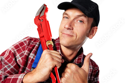 Foto: plumber with casing tongs and thumb up plumber with casing tongs and thumb up