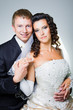 just married bride and groom on grey background