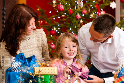 Photo: Christmas - family with gifts on Xmas Eve Christmas - family with gifts on Xmas Eve
