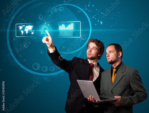 Photo: Businessman pressing high tech type of modern buttons Businessman pressing high tech type of modern buttons