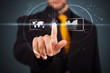 Businessman pressing high tech type of modern buttons
