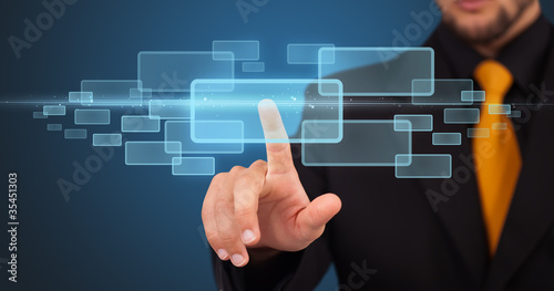 Photo: Businessman pressing high tech type of modern buttons Businessman pressing high tech type of modern buttons