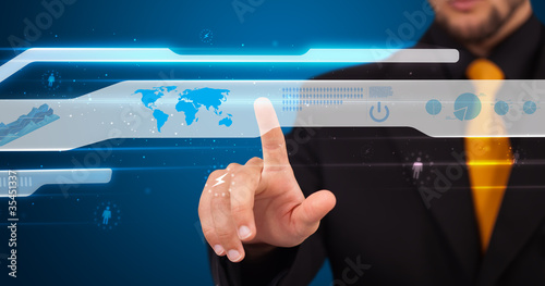 Photo: Businessman pressing high tech type of modern buttons Businessman pressing high tech type of modern buttons