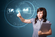 Businesswoman pressing high tech type of modern buttons