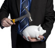 business man breaking piggy bank with hammer