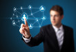 Foto: Businessman pressing modern social type of icons Businessman pressing modern social type of icons