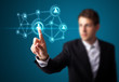 Foto: Businessman pressing modern social type of icons Businessman pressing modern social type of icons