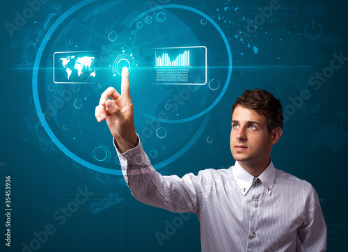 Foto: Businessman pressing high tech type of modern buttons Businessman pressing high tech type of modern buttons