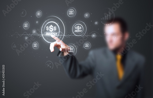 Photo: Businessman pressing modern business type of buttons Businessman pressing modern business type of buttons