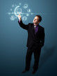 Businessman pressing virtual media type of buttons Businessman pressing virtual media type of buttons