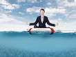 Businessman meditating on the rescue ring