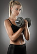 Foto: Young athletic woman doing workout Young athletic woman doing workout