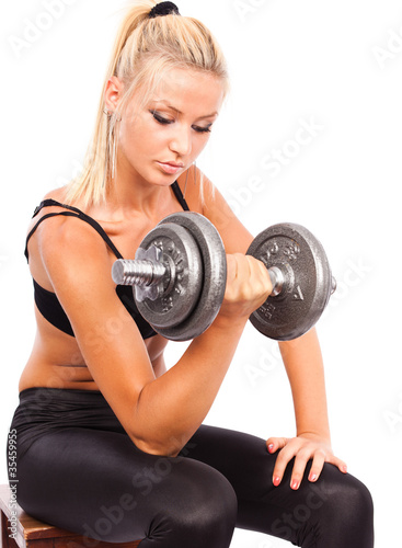 Foto: Young woman doing workout Young woman doing workout