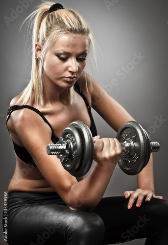 Photo: Young athletic woman doing workout Young athletic woman doing workout