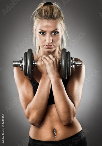 Photo: Young athletic woman doing workout Young athletic woman doing workout