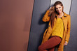 beautiful young  woman in autumn city