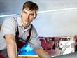 Foto: Motor mechanic is fixing the engine of a car Motor mechanic is fixing the engine of a car