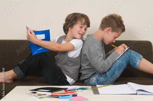 Photo: Doing homework on the couch Doing homework on the couch
