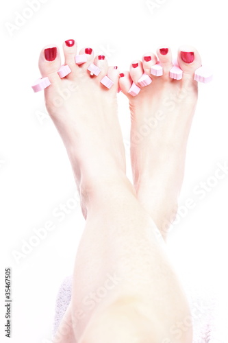 Photo: female feet red polished nails female feet red polished nails