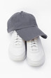 Running shoes and baseball cap