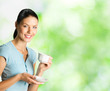 Young woman drinking coffee, outdoors, copyspace