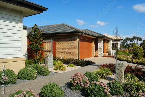 Photo: Suburban street with new modern houses Suburban street with new modern houses