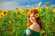 Foto: Red-haired woman with sunflowers Red-haired woman with sunflowers