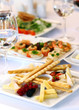 Different snacks for wine on banquet table