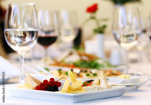 Photo: Different snacks for wine on banquet table Different snacks for wine on banquet table