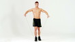 Handsome muscular man exercising with rubber on white