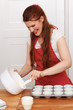 Woman baking cupcakes
