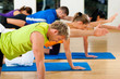 Stretching and gymnastics in fitness club or gym