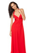Beautiful female fashion model posing in red dress