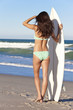 Beautiful Woman Surfer In Bikini With Surfboard At Beach