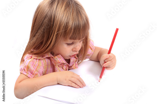 Photo: Little girl drawing pictures Little girl drawing pictures