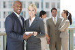 Foto: Interracial Men & Women Business Team With Tablet Computer Interracial Men & Women Business Team With Tablet Computer