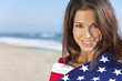 Young Woman Wrapped in American Flag Towel on a Beach