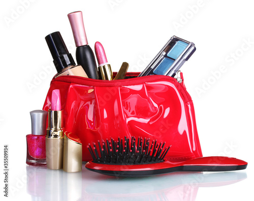 Photo: Beautiful red makeup bag and cosmetics isolated on white Beautiful red makeup bag and cosmetics isolated on white
