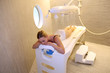 Woman laying down table for spa treatment