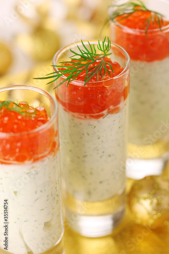 Photo: Appetizer with cream cheese and red caviar for Christmas table Appetizer with cream cheese and red caviar for Christmas table