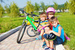 Photo: Siblings sitting on grass Siblings sitting on grass