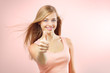 Portrait of attractive gir showing a thumbs up