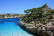 Blue and clear water , and rocks.
