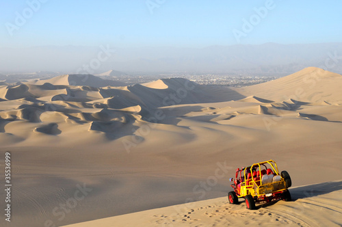 Photo: Sand Dessert with Dune Buggy Sand Dessert with Dune Buggy